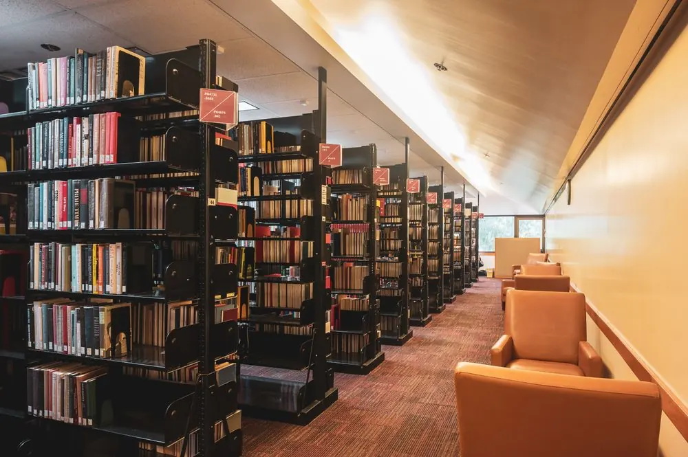Bookshelves and reading desks in a bright modern library