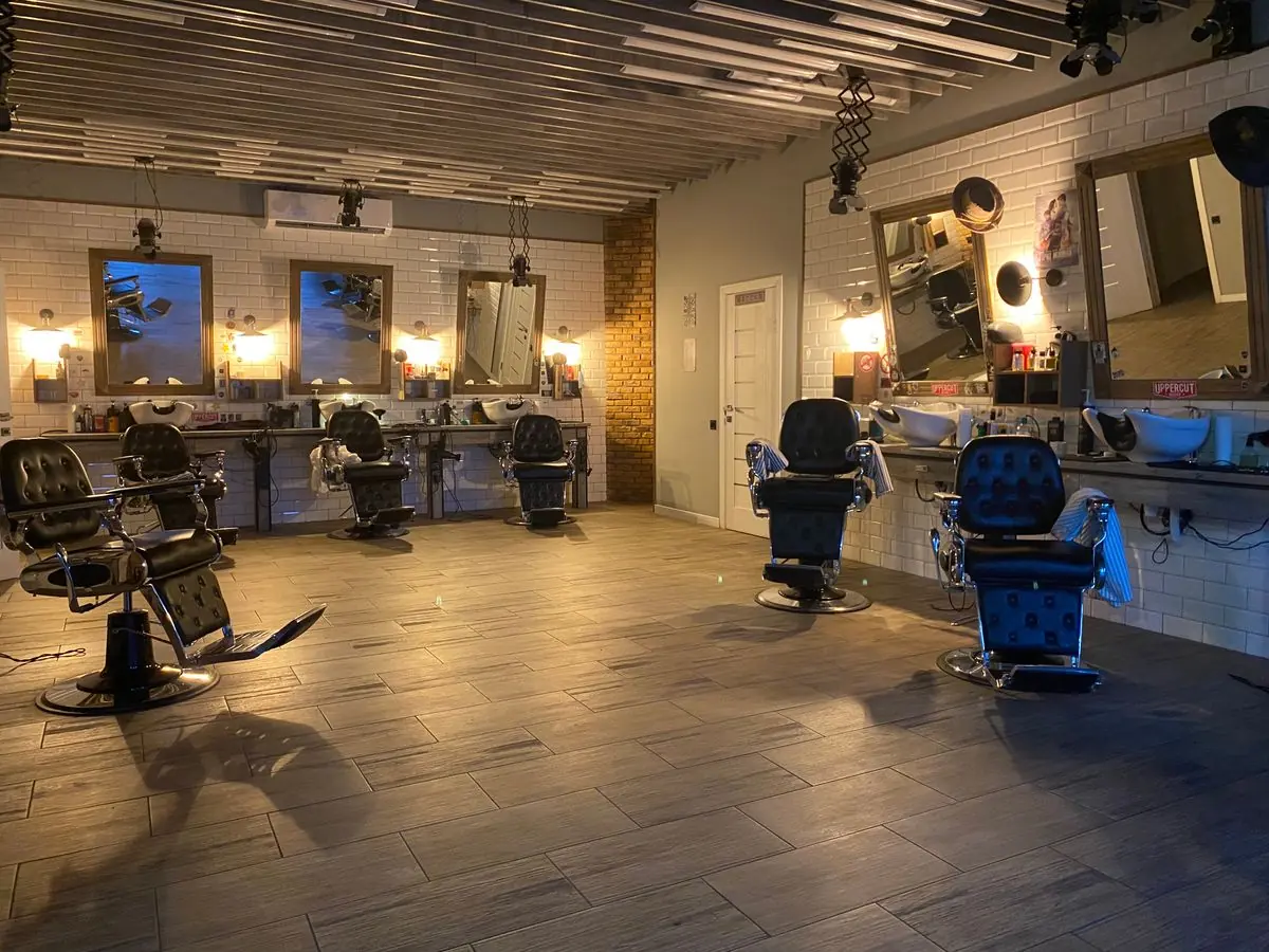 Warmly lit salon with mirrors and styling chairs