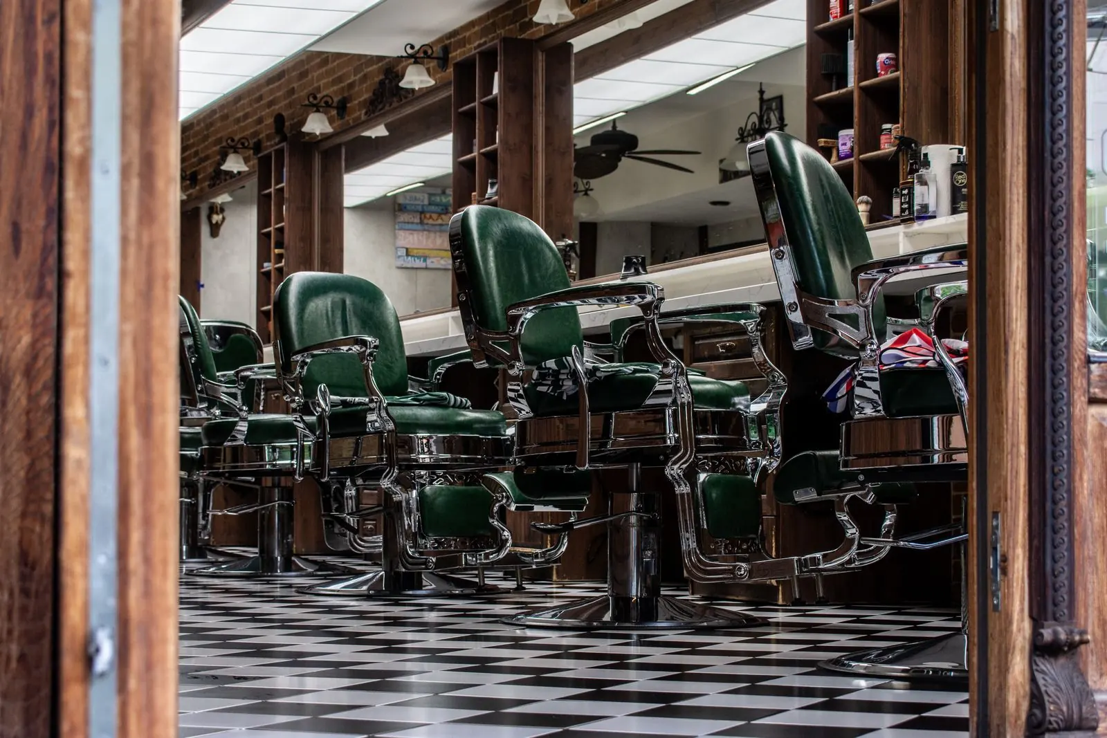 Classic barber chairs arranged inside a timber-framed barbershop