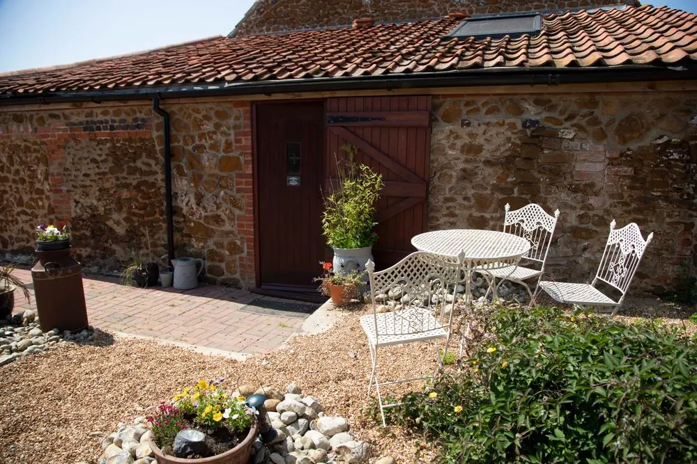 Sheltered stone courtyard with outdoor seating