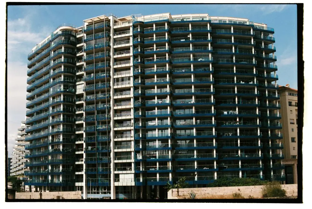 Modern residential apartment facade with repeating balconies