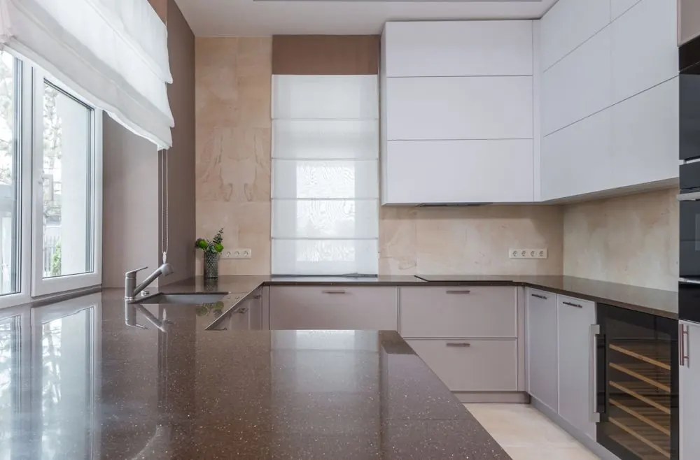 Clear kitchen worktop and sink in a light interior